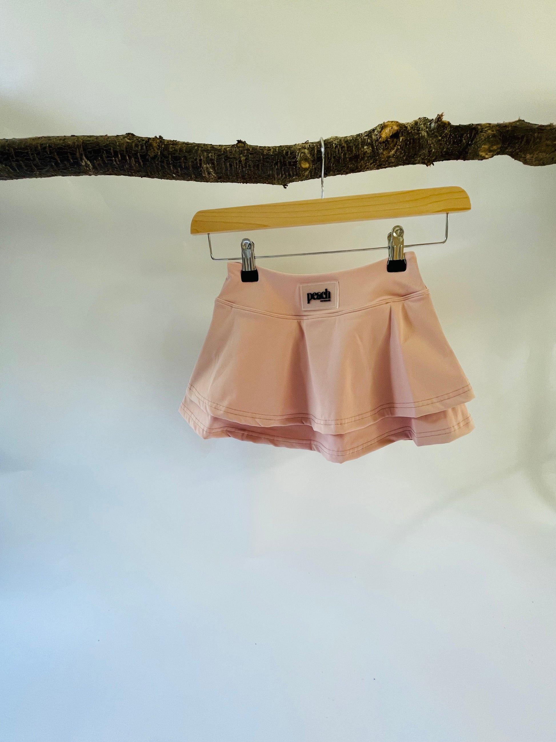Girls blush pink active skort for sports and movement.